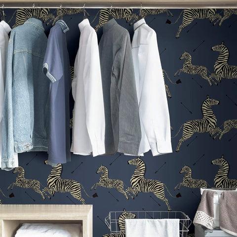 Closet with clothes against wall covered in Blue Denim Zebra Safari Peel And Stick Wallpaper Self Adhesive Wall Covering.