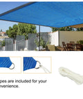 Blue Sun Shade Sail 3 Ft By 7 Ft Straight Edge With Grommets installed over patio, ropes, and D rings visible