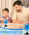 Child and adult examining globe from 24 Piece Mini World Globe Set For Kids Learning Kid Friendly 3 Point 4 Inch Rotating Globes With Stands Classroom Desk Centerpieces And Geography Education Decor Blue Great For Homeschool And Classrooms.