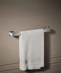 Honesty 18 Inch Towel Bar Polished Chrome For Modern Bathrooms mounted with white towel on wall