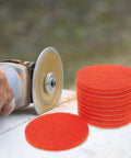 Rock Solid 2000 Grit Orange Nylon Sanding Discs With Hook Loop Design for smoothing wood and metal during repairs.