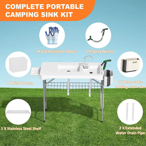 Beefy All Weather Folding Fish Cleaning Table With Dual Sinks on grass, showing accessories like spray nozzle and storage features.