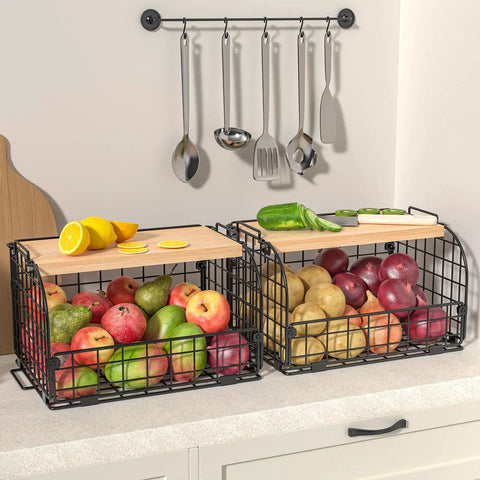 Keep Your Counters Tight With This Solid Stackable Wire Basket Set Designed To Sweep Up Kitchen Clutter While Offering Plenty Of Room For Sorting Fresh Produce Spices And Snacks. Two stackable black wire baskets filled with apples and potatoes, featuring bamboo tops.