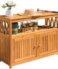 Weatherproof Acacia Wood Outdoor Storage Cabinet With Two Magnetic Doors And Three Level Storage in brown, garden scene