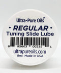 Front view of a white circular container lid labeled Ultra-Pure Oils Regular Tuning Slide Lube, 9 ml, Made in USA.