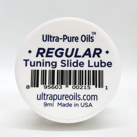 Front view of a white circular container lid labeled Ultra-Pure Oils Regular Tuning Slide Lube, 9 ml, Made in USA.