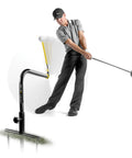 Golfer using Pure Path Golf Swing Trainer Yellow Large For Immediate Swing Path Feedback, no net needed, ground-stakes setup