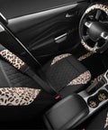 Interior view of Dope Leopard Print Faux Leather Car Seat Covers, Leopard Car Mats, Steering Wheel Cover, And Seat Belt Pad Set