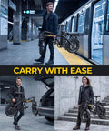 Person carrying compact electric dirt bike for adults with 14 inch tires, 48V battery, 500W motor, foldable and lightweight