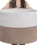 Person holding XXL Cotton Rope Blanket Basket With Handles For Living Room Storage 21.7 Inches Square And 13.8 Inches Tall Handwoven