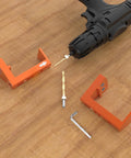 Undermount Drawer Drilling Guide Pro Kit with aluminum drill angle guide, steel inserts, drill bits, and parts on wooden surface.