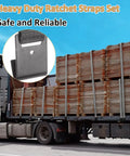 Heavy Duty 4 Pack 2 Inch Ratchet Straps With Durable Flat Hooks For Secure Cargo Tie Downs On Trucks And Flatbeds Deliver Rock Solid Hold When You Gotta Lock Down Gear During Moves Or Serious Highway Hauls In Stealth Black, shown securing lumber on a truck.