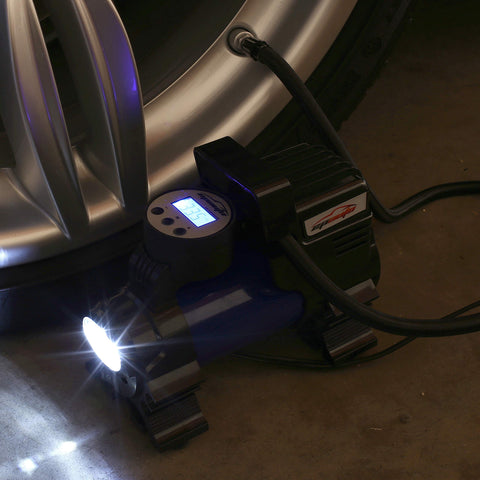 12V Portable Air Compressor Pump with Digital Tire Inflator connected to car wheel, cigarette lighter power, fast inflate feature visible