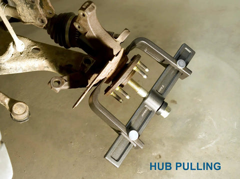 Heavy Duty Hub Drum And Rotor Puller Kit For Impact Wrench Removal Beefy Eight And A Half Ton Forged Construction in use on a hub