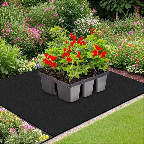 Automatic Gardening Capillary Mat With Labels 47x39 Inch Plant Water Wicking Mat outdoors in garden with potted red flowers.