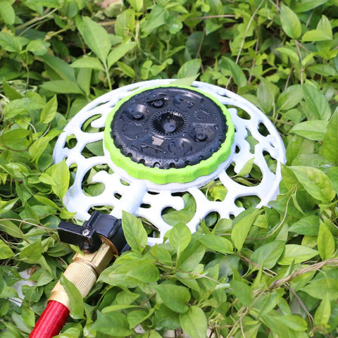 8 Pattern Turret Sprinkler with Metal Base on grass, showing spray patterns and stable design for lawn yard garden or odd shaped areas.