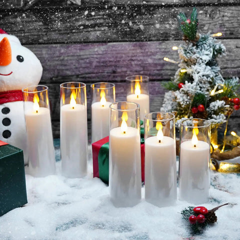 White Flameless Candles With Remote Control And Timer, 9 Piece LED Pillar Candle Set in snow with festive decor