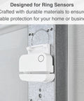 Close-up of Garage Door Bracket Mount For Alarm Contact Sensors Gen 2 Sensor Not Included installed, showing peel and stick design.