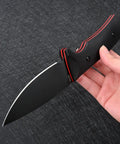 VG10 Steel Fixed Blade Tactical Knife With Ergonomic Micarta Handle And Kydex Sheath held by hand on black background