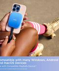 2TB Creator Phone SSD attached to iPhone via MagSafe, in use by person with roller skates, showing mobile setup outdoors