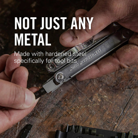 Hands using 21 Double Ended Screwdriver Bits Bit Kit For Multi Tools Ready For Any Job on a wooden surface