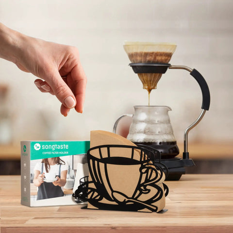 Durable Coffee Filter Holder And Paper Storage Rack With Cup Shaped Stand For Fan Shaped T Shaped And Square Paper Filters Must Have For Home Kitchen Restaurant Picnic Or Wedding Accessory on a wooden counter next to a drip coffee setup.