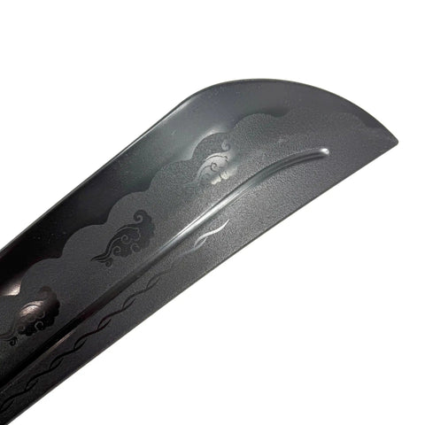 Close-up of black 18 inch polypropylene Wing Chun sword blade with wave design, part of the Wing Chun Sword Set Of 2 In Black Durable Practice Swords
