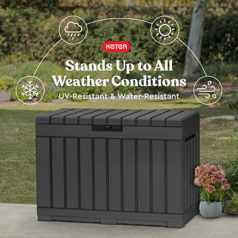 Kentwood 50 Gallon Resin Deck Box for Outdoor Storage and Organization of Patio Cushions Pillows Beach Towels and Garden Tools in Dark Grey Weatherproof Durable Rustproof for the Backyard Crew in garden setting.