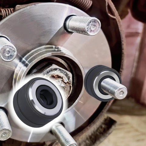 Close-up of Wheel Stud Installer Tool for Most Cars and Light Duty Trucks next to lug bolts on a vehicle hub.