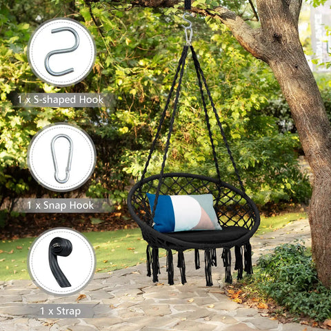 Black macrame hammock chair swing hanging from tree, showing cushioned seat and hardware kit items for indoor outdoor chill.