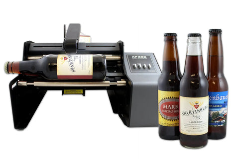 Hustle Ready Semi Automatic Label Applicator For Cylindrical Bottles Cans Jars And Tubes With No Sweat Setup and Smooth Operation Up to 1200 Per Hour For Production Lines in action with beer bottles.