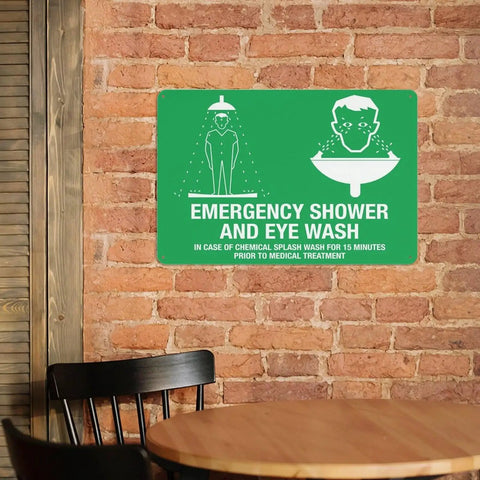 Emergency Shower And Eye Wash Outdoor Safety Sign For Chemical Hazards 8x12 Wall Plaque in rustic room setting.