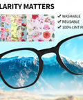 Front view of microfiber cleaning cloths with multicolor floral pattern (7x6 in) next to black eyeglasses.
