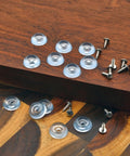 Clear Rubber Feet For Cutting Boards Lock Down Tight Non Slip Bumpers With Stainless Screws on wooden surface.