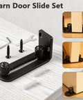 Four Pack Black Sliding Barn Door Floor Guides Flush Wall Mount Bottom Adjustable Rollers displayed on wooden surface