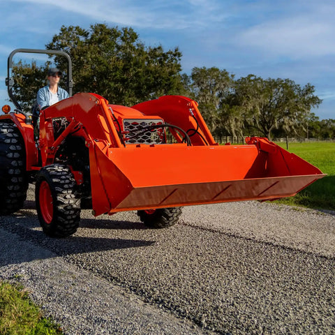 Kubota tractor in action, compatible with All In One Tractor Filtration Maintenance Kit With Oil Fuel Air And Hydraulic Filters