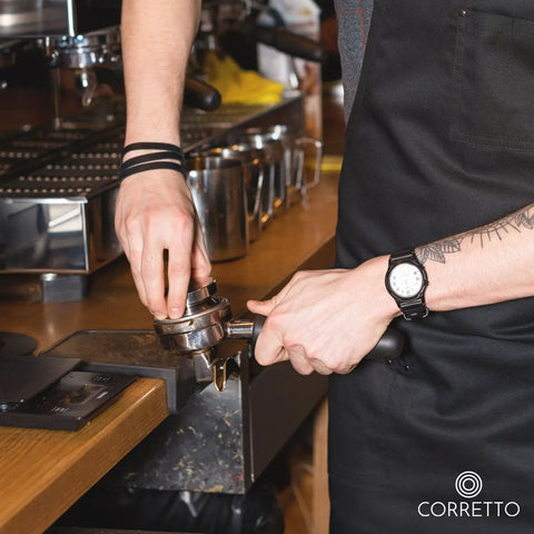 Barista using Pro Grade Espresso Tamping Mat With High Grip Food Grade Silicone Black Corner Tamper And Packing Mat