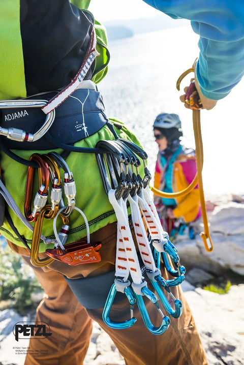 Climber with Sm'D Carabiner With TRIACT-LOCK on harness, lightweight D-shape climbing biner in bright yellow, quickdraw setup
