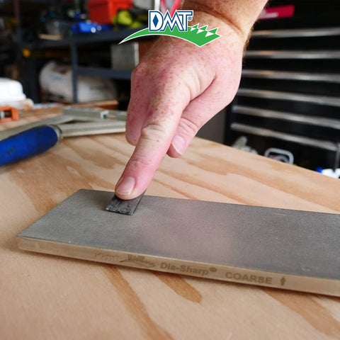 Hand using Dia Sharp Diamond Knife Sharpener Bench Stone For Home Shop And Jobsite Coarse 325 Grit Flat Diamond Surface