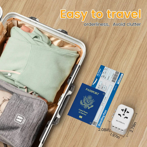 Universal Travel Plug Adapter With 4 USB Ports And Wall Charger next to passport and boarding pass in suitcase