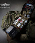 Front view: Everlit Survival OD green advanced emergency trauma kit in a tactical MOLLE bag with organized medical pouches.