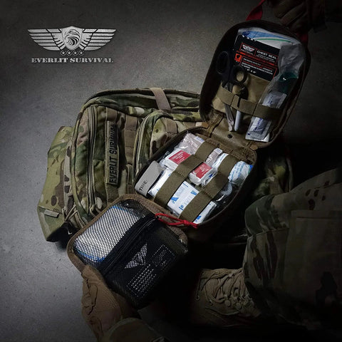 Front view: Everlit Survival OD green advanced emergency trauma kit in a tactical MOLLE bag with organized medical pouches.