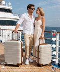 Luggage set: two beige ABS+PC hardshell suitcases with brown trim and spinner wheels on a cruise deck.