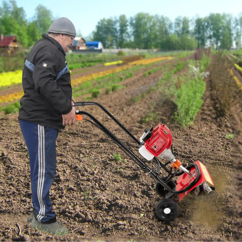 Man using 52CC Gas Powered Tiller Cultivator With 2 Stroke Engine in a farm field