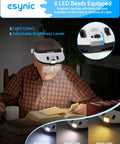 Person reading with Head Magnifier With LED Light For DIYers Up To 6X Magnification With 5 Interchangeable Lenses from 1X to 3.5X.