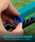 Hand cleaning nozzle on Oscillating Sprinkler With Adjustable Spray And 16 Clog Resistant Nozzles Metal Base For Up To 3600 Sq Ft Coverage