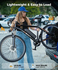 Woman loading Electric Mountain Bike For Adults With 1000W Peak Motor And 20 MPH Top Speed, 40 Mile Range into car trunk