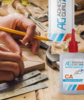 Adhesive Guru CA glue bottle with activator on a woodworking workbench beside measuring tools.