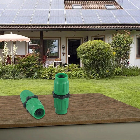 Upgrade Your Sprinkling Game With This Expandable Garden Hose Repair Kit Featuring Quick Snap Connectors For 5/8 And 3/4 Inch Fit Compatible With All Major 25 To 100 Foot Extensible Hoses To Slash Any Leaks Or Bursts Fast. Green plastic hose repair connectors on a table.
