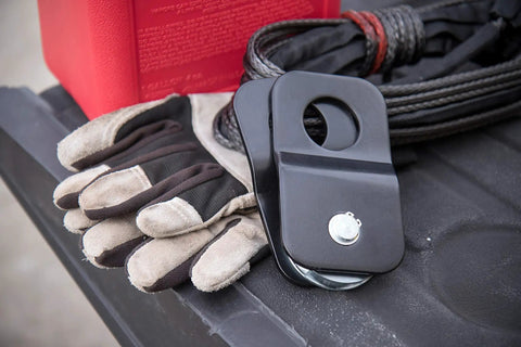 8000 Lb Snatch Block For Off Road Winch Systems That Doubles Pull Power And Eases Angled Pulls Reduces Winch Heat And Gear Stress Fits Up To Five Sixteenth Inch Wire Rope Heavy Duty Black Powder Coated Brackets; black snatch block with winch rope and gloves